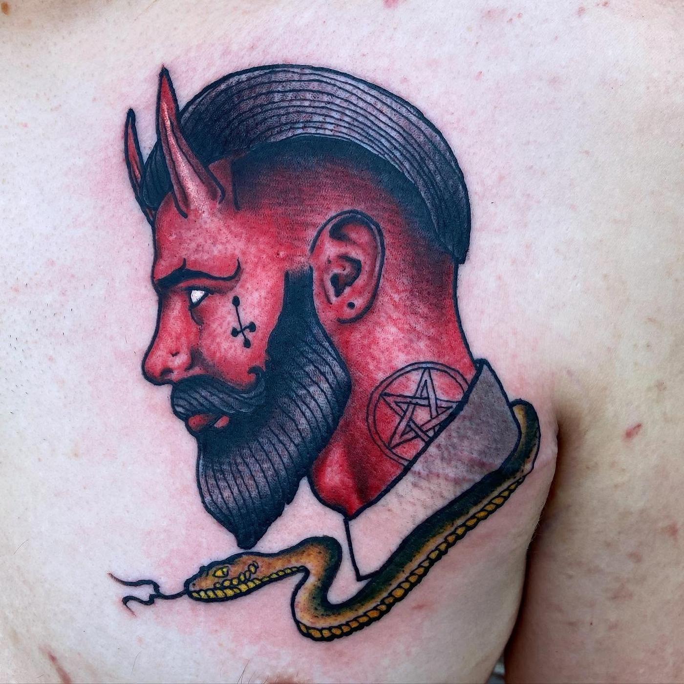 The finished tattoo of that design on a shoulder