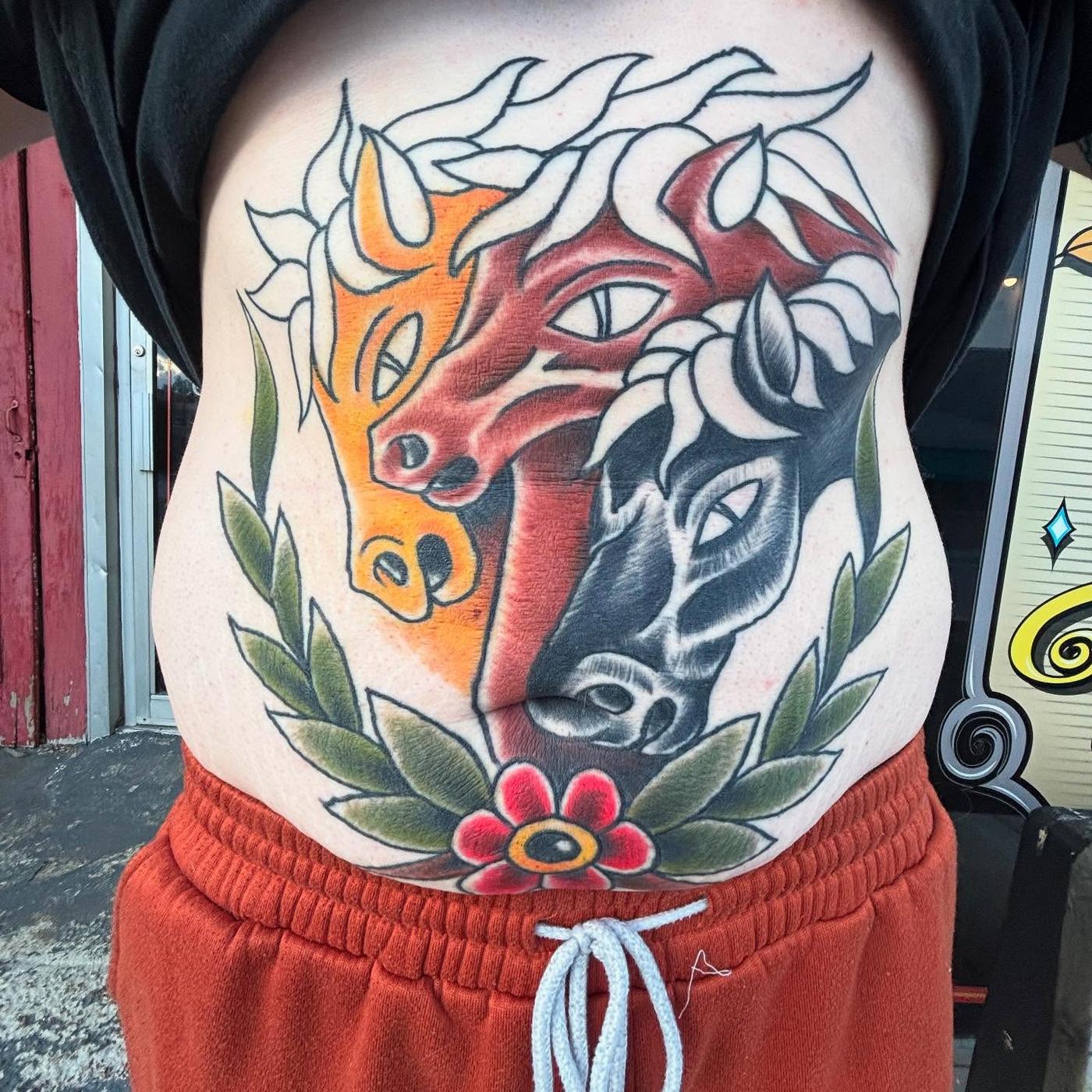A color neo-traditional two headed horse tattoo