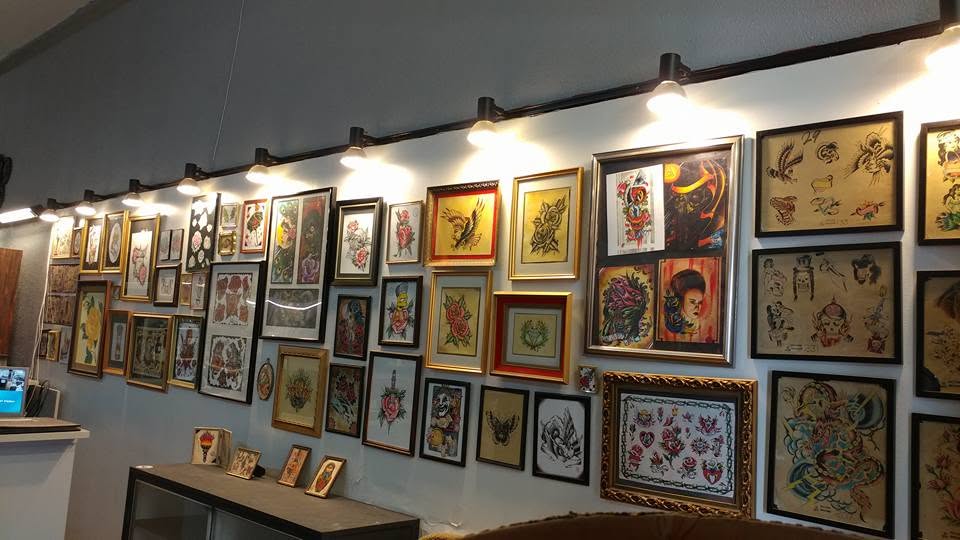 The front room at True Hand Tattoo, lined with framed flash art